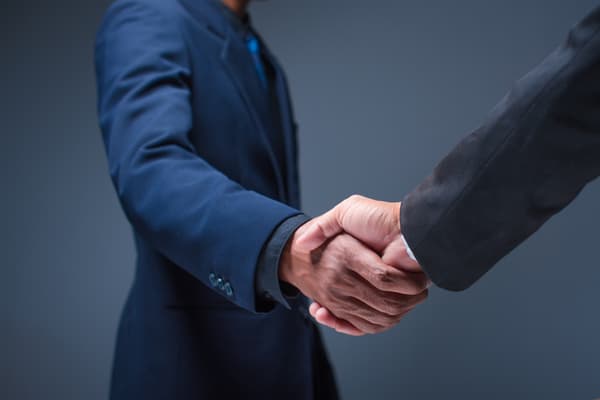 Business people shake hands office